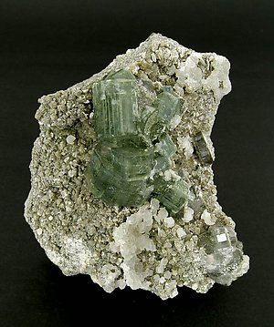 Fluorapatite with Calcite and Muscovite.