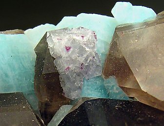 Quartz (variety smoky) with Microcline (variety amazonite) and Fluorite. 