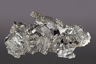 Arsenopyrite with Siderite and Pyrite.