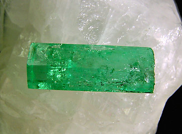 Doubly terminated Beryl (variety emerald) on Calcite. 