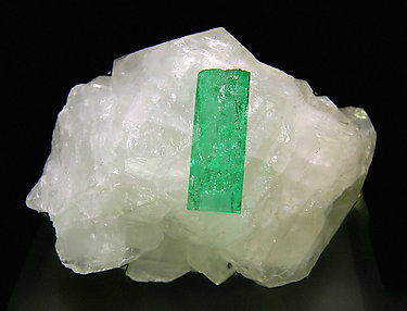 Doubly terminated Beryl (variety emerald) on Calcite. 