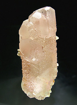 Fluorite (spinel twin) with Muscovite and Quartz. Top