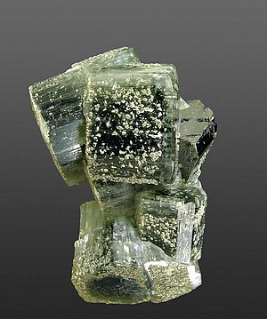 Fluorapatite with Ferberite and Muscovite.