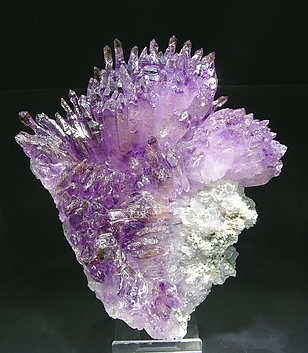 Quartz (variety amethyst) with Hematite inclusions.