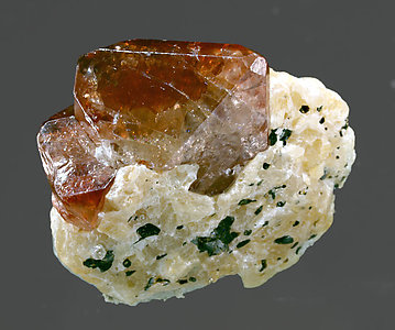 Zircon with Calcite and Mica.