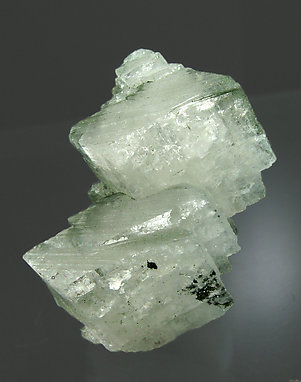 Orthoclase (variety adularia) with Chlorite and Hematite.