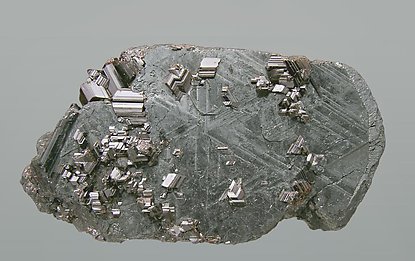 Rutile and Hematite pseudomorph after Ilmenite.