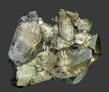 Quartz (variety smoky) with inclusions and Chlorite.