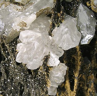 Cerussite on Quartz with Goethite inclusions. 