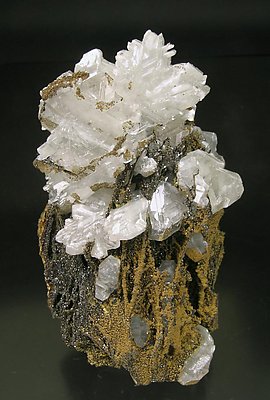 Cerussite on Quartz with Goethite inclusions.