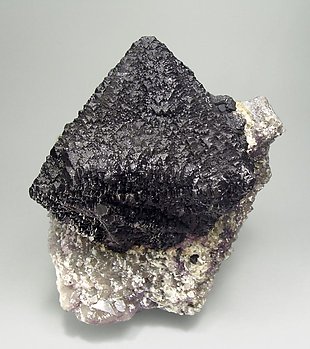 Octahedral Fluorite with Bertrandite, Quartz and Pyrite.