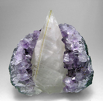 Calcite with Quartz (variety amethyst) and Hematite.