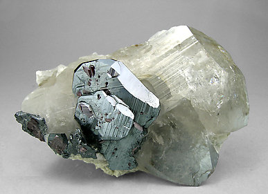 Hematite with smoky Quartz and Rutile. 