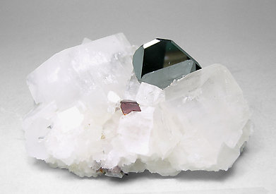 Hematite with Fluor-uvite and Magnesite.