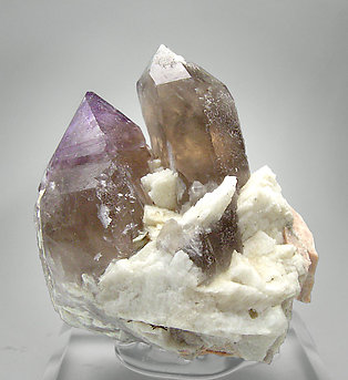 Quartz (variety amethyst) with smoky Quartz, Albite and Microcline.