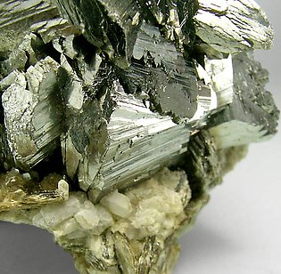 Arsenopyrite with Topaz and Siderite. 