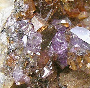 Pharmacosiderite with Strengite. 