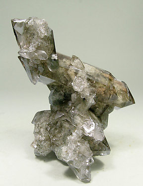 Quartz (variety smoky) with inclusions and Chlorite. 