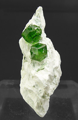 Andradite (variety demantoid) with Amphibole. 