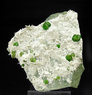 Andradite (variety demantoid) with Amphibole.