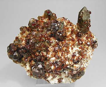 Spessartine with smoky Quartz and Feldspar. 