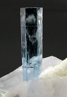 Beryl (variety aquamarine) with Quartz, Albite, Schorl, Garnet and Muscovite. 