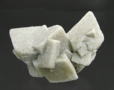 Calcite with inclusions of sand. Rear
