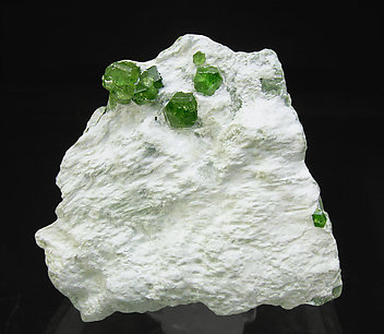 Andradite (variety demantoid) with Amphibole.