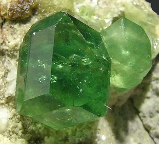 Andradite (variety demantoid). 