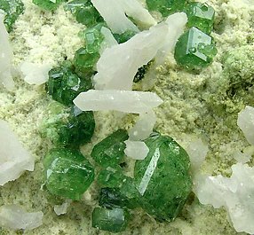 Andradite (variety demantoid) with Quartz. 