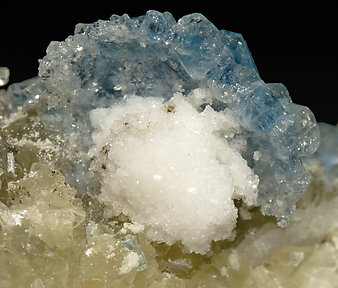 Fluorapatite with Bertrandite, Albite, Muscovite and Quartz. 