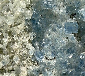 Fluorapatite with Bertrandite, Albite, Muscovite and Quartz. 