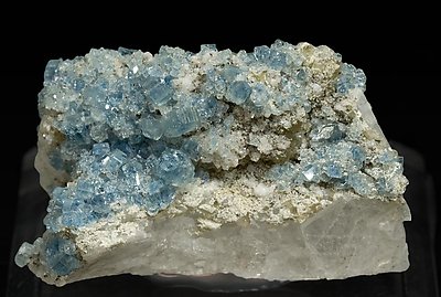 Fluorapatite with Bertrandite, Albite, Muscovite and Quartz.