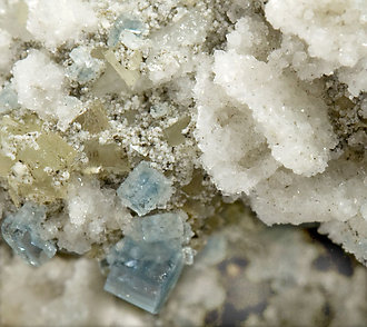 Fluorapatite with Bertrandite, Albite, Muscovite and Quartz. 