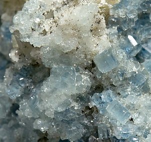 Fluorapatite with Bertrandite, Albite, Muscovite and Quartz. 