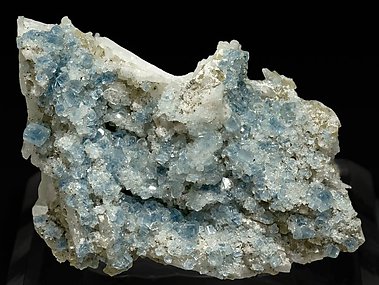 Fluorapatite with Bertrandite, Albite, Muscovite and Quartz. 