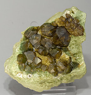 Andradite (variety topazolite) with Quartz. Side