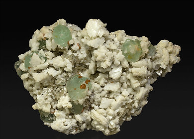 Fluorite with Albite (Pericline), Spessartine and Muscovite.