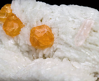 Spessartine with Spodumene (variety kunzite), Albite and 'lepidolite'. 