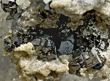 Cassiterite with Quartz, Dolomite and Tourmaline. 