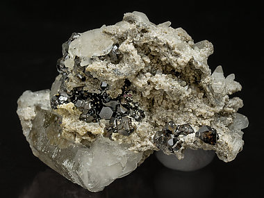 Cassiterite with Quartz, Dolomite and Tourmaline. 