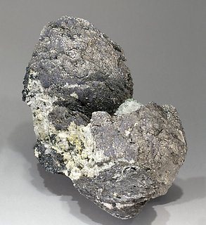 Löllingite with Magnetite and Calcite. Rear