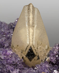 Quartz (variety amethyst) with Calcite and Hematite. 