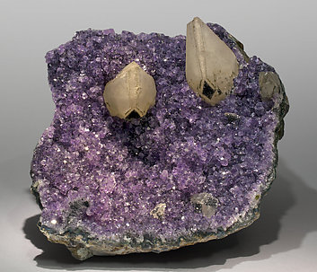 Quartz (variety amethyst) with Calcite and Hematite.