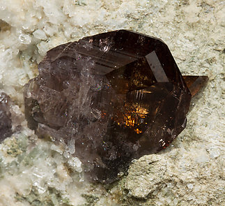 Axinite-(Fe) with Quartz and Calcite. 