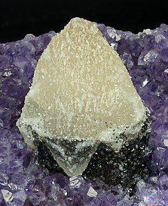 Calcite with Quartz (variety amethyst) and Hematite. 