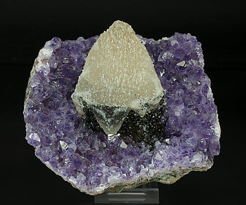 Calcite with Quartz (variety amethyst) and Hematite. 