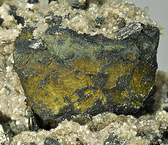 Chalcopyrite with Stannite, Arsenopyrite and Muscovite. 