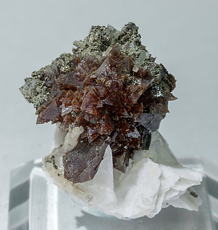 Helvine-Danalite with Calcite and Chlorite.