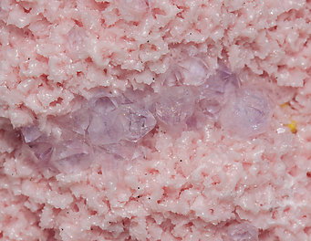 Rhodochrosite with Quartz (variety amethyst) and Helvine. 